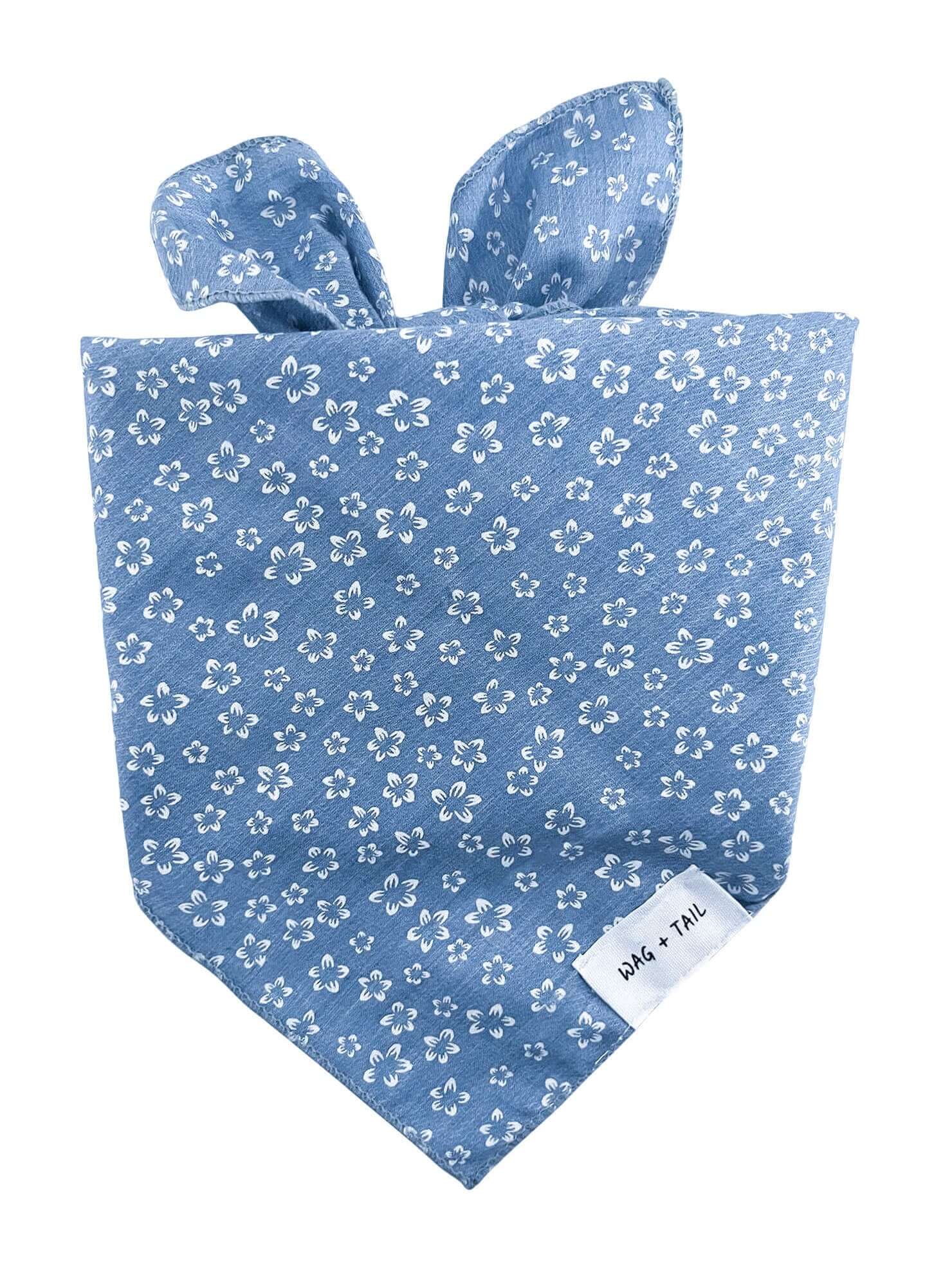 Wag + Tail Blue Blossom dog scarf with a soft blue floral pattern tied around a dog’s neck